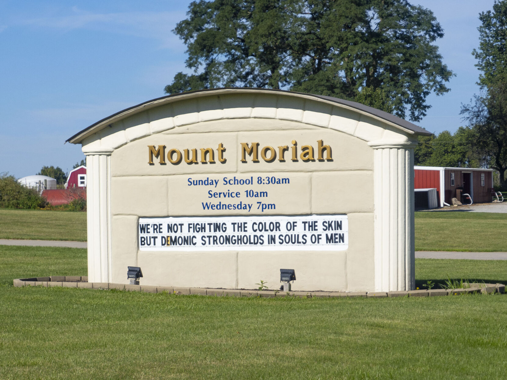 Local church's sign stirs racism controversy; woman takes action